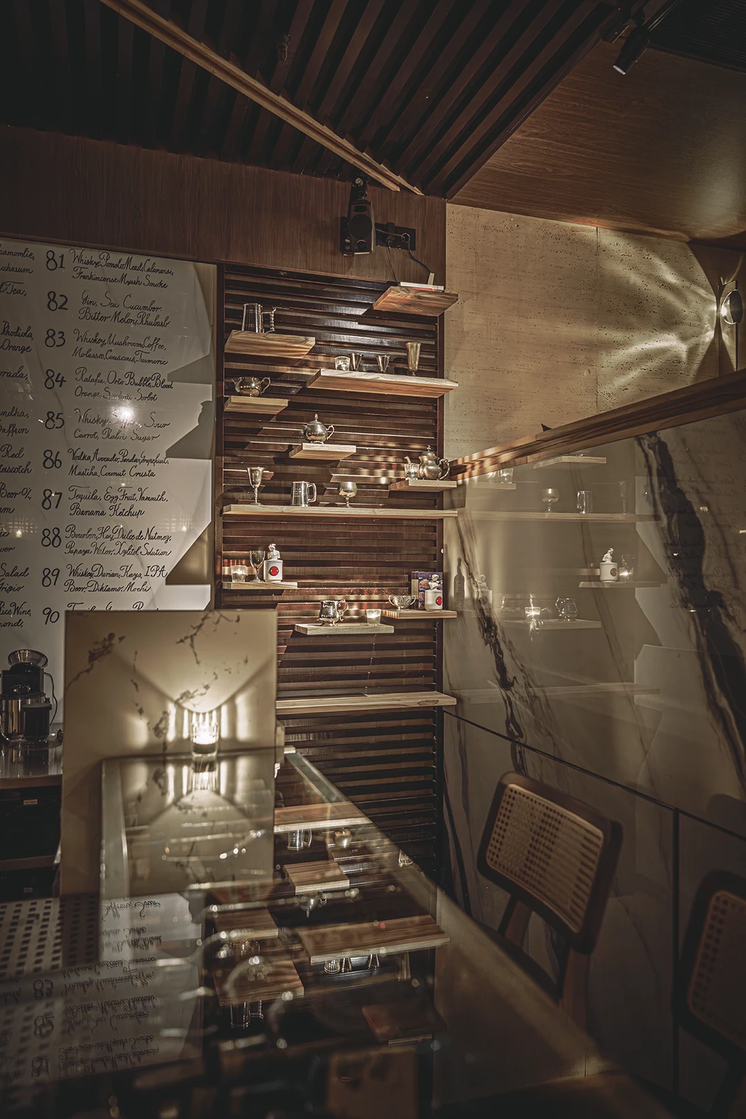 Glassware shelves and cocktail archive at Reply Bar Chengdu